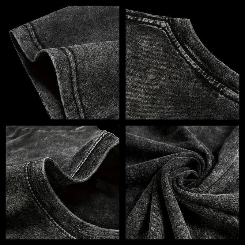 Close-up of black denim fabric with stitching details on a black background